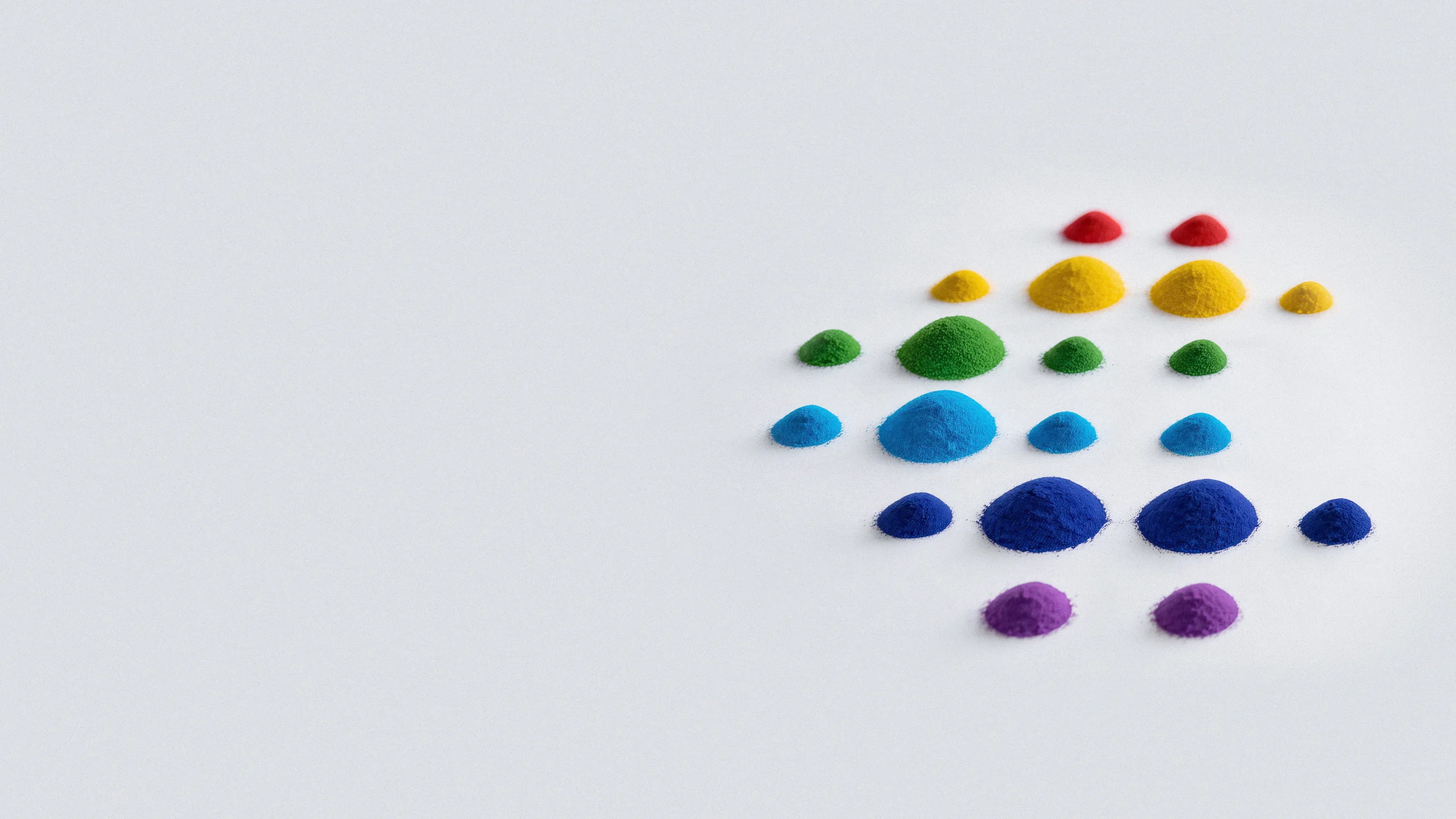 Watercolor-style blue pigment circles on a white background.